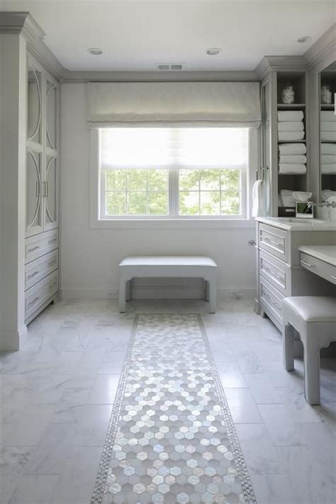 For decades, schots has been known for quality cabinetry, eclectic bath tiles and high quality bathroom tapware and unique bathroom vanities found nowhere else. White and gray glass hex tiles lead to a light gray bench ...