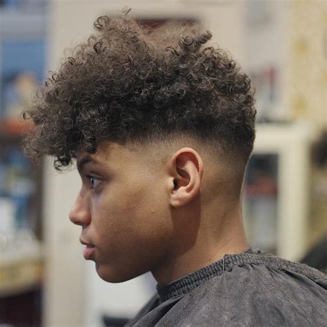 If shorter hair is more your vibe, that's cool. 3A Curly Hair Fade For Men - Wavy Haircut