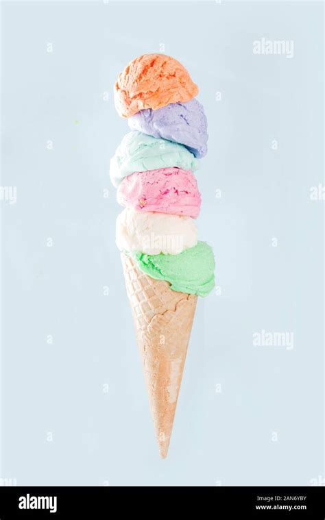 Stack Of Pastel Colorful Ice Cream Scoops In Waffle Cone Isolated On