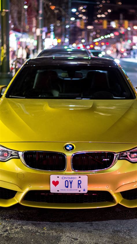 Download Wallpaper 2160x3840 Bmw M4 Bmw Car Yellow Front View