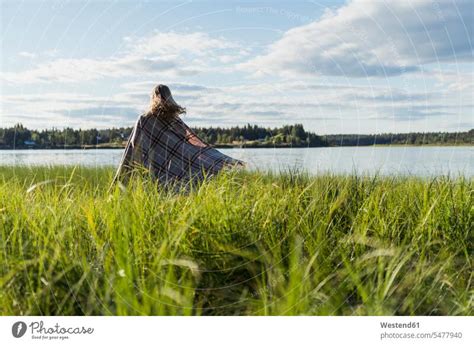 Finland Lapland Woman Wrapped In A Blanket At The Lakeside A