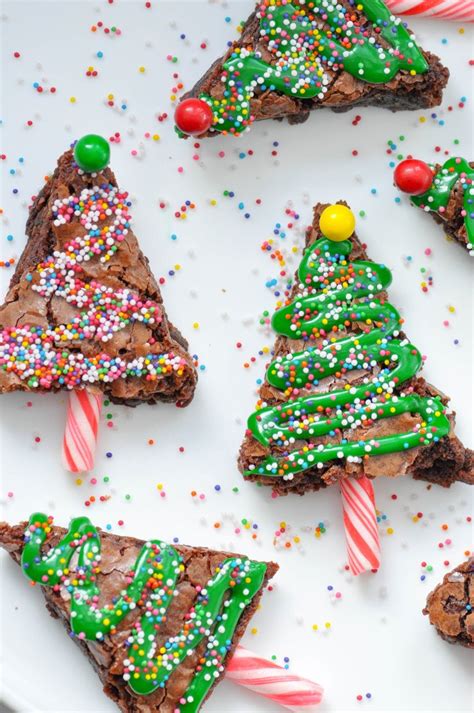 These easy santa hat christmas brownies are topped with strawberries and cream. Kara's Party Ideas Brownie Christmas Trees Recipe + Holiday Cleanup Made Easy | Kara's Party Ideas