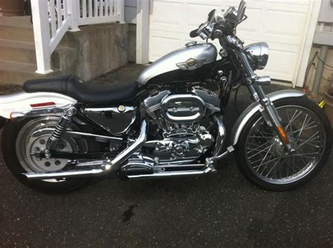 The original anniversary edition seat was sealed and stored and is in new condition (see photos). 2003 Harley Davidson Sportster 100th for sale on 2040-motos