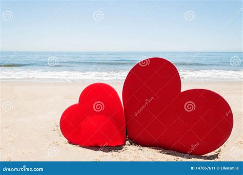 Two Hearts On The Sandy Beach Background Stock Image Image Of Holiday