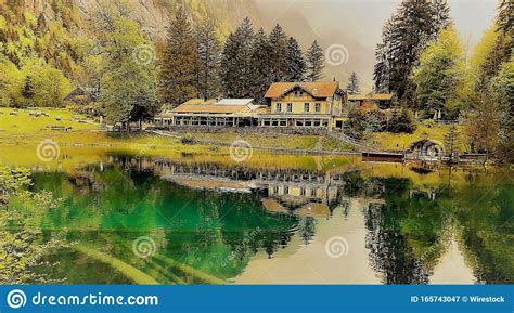 Beautiful Country House In The Middle Of A Green Scenery Reflecting In