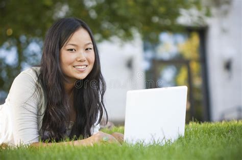 Asianet live is available in australia, united kingdom, malaysia. Asian Student Studying On Laptop Computer Stock Photo ...
