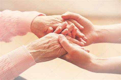 Helping Hands Care For The Elderly Concept Stock Photo By ©belchonock