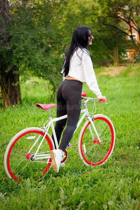 White And Red Bike Stylish Female Red Bike Standing On A Sunny Day