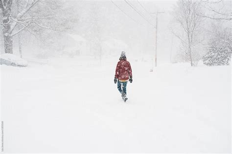 Young Woman In The Snowstorm Del Colaborador De Stocksy Léa Jones
