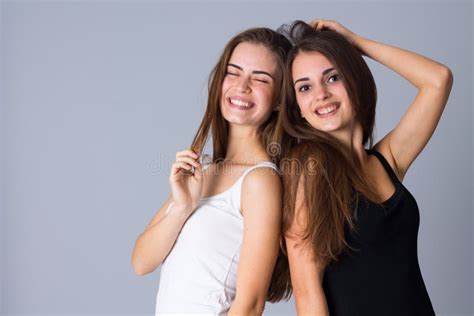Two Young Women Smiling Stock Photo Image Of Standing 79571230