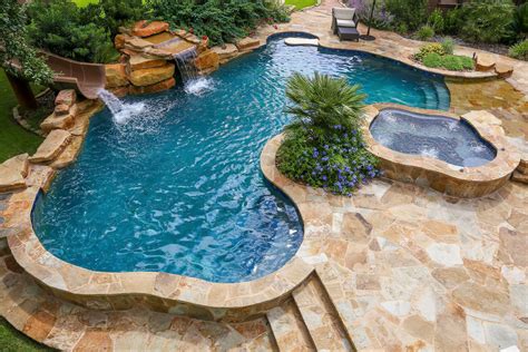 Beach Entry Swimming Pool With A Slide And Waterfall Luxury Pools