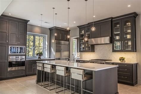 Even though, in theory, that can make the kitchen seem smaller this is rarely the case since most modern the cabinetry contrasts with the crisp white walls and ceiling and the palette is completed by black marble countertop and backsplash surfaces. 45+ Kitchens with Dark or Black Cabinets - Home Awakening