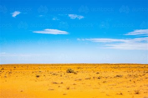 Image Of Dry Barren Orange Land Against The Blue Sky Austockphoto