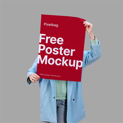 Woman Holding A Poster Psd Mockup — Pixelbag Free Design Resources