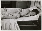 [Gerda Taro on a bed, Paris] | International Center of Photography