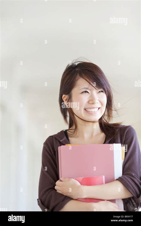 Young Woman Holding Books Japan Stock Photo Alamy