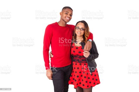 Happy Mixed Race Couple Hugging Over A White Background Stock Photo