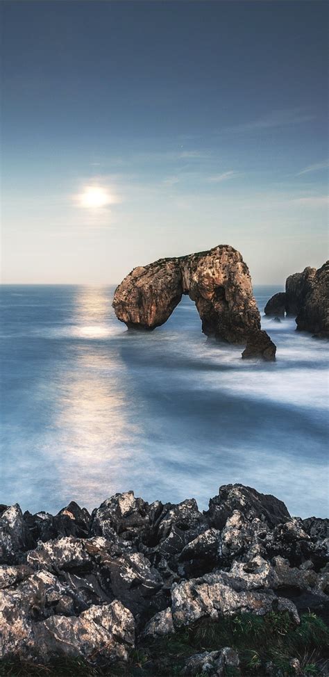 1440x2960 Arch Coast Horizon Nature Ocean Rock Sky Sun Samsung Galaxy