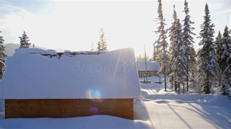 Fantastic Winter Landscape With Wooden House In Snowy Mountains