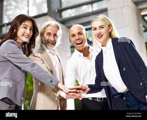 Caucasian Asian Latino Corporate Business People Putting Hands Together