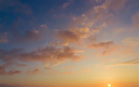 Beautiful Sunset Clouds In Soft Pastel Tones Over Horizon Stock Photo
