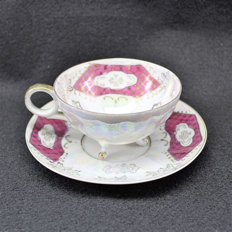 Iridescent Footed Tea Cup And Saucer Hallmarked C Gold And Magenta Teacup And Saucer