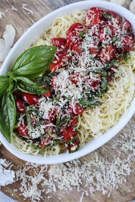 I marinate cherry tomatoes, basil, and garlic in olive oil for four hours, then boil a pound of angel hair pasta and add it to the tomatoes with lots of freshly grated. Ina Garten's Summer Pasta Salad - Jen Around the World