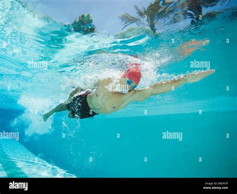 Mixed Race Man Swimming In Swimming Pool Stock Photo Alamy
