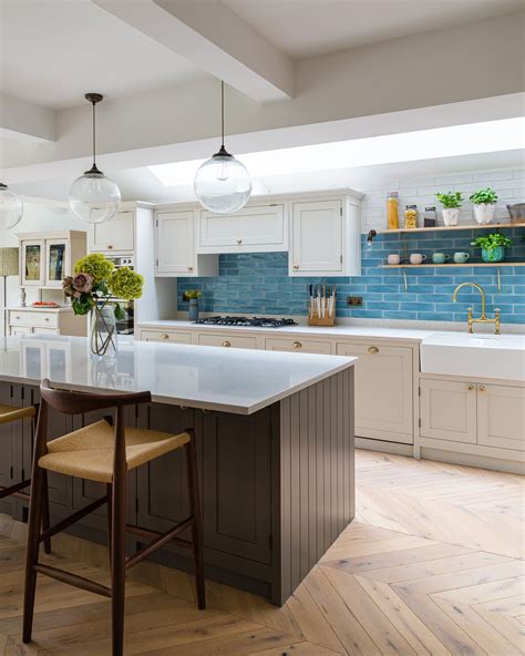 Dark Grey Kitchen Island With White Shaker Cabinetry Design By The