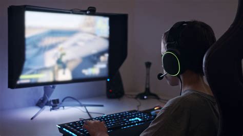 Child Gaming With Headset Seated At Computer Stock Footage Sbv