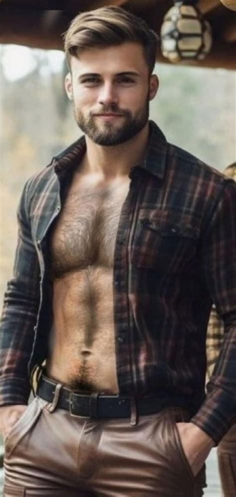 A Shirtless Man Wearing Leather Pants And A Plaid Shirt