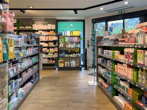 Wide View Over Modern French Drug Store Interior With Multiple Shelves