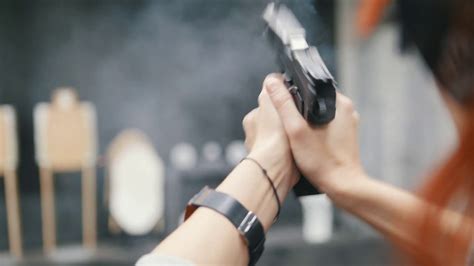 Woman Shooting With Pistol Gun In Shooting Stock Footage SBV 318846739