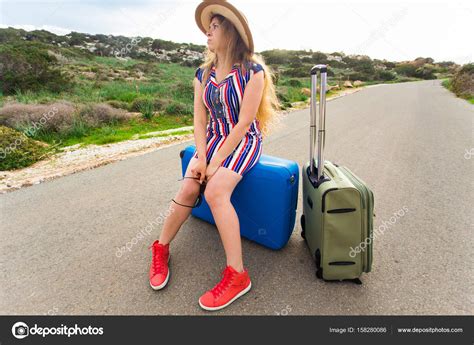 Sad Woman Sitting On Suitcase — Stock Photo © Satura 158280086