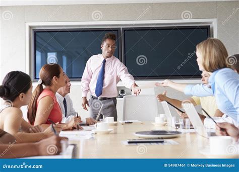 Group Of Businesspeople Meeting Around Boardroom Table Stock Image Image Of Discussion