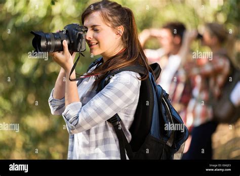 Pretty Female Photographer Taking Pictures In The Nature Stock Photo