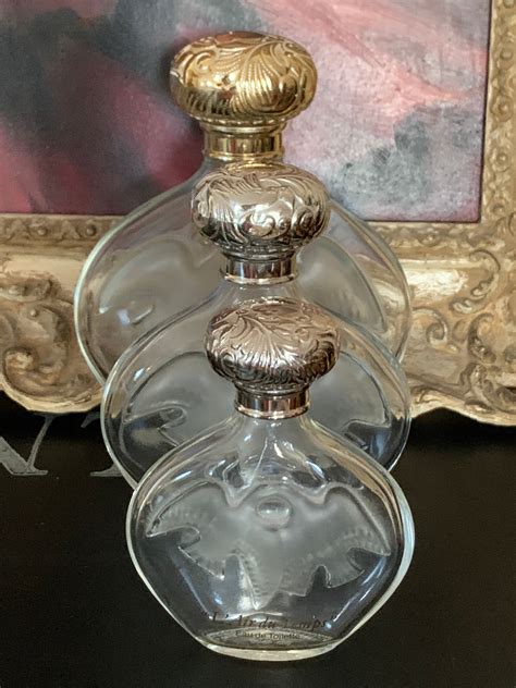 Three Graduating In Size Vintage Lalique Designed Perfume Bottles By