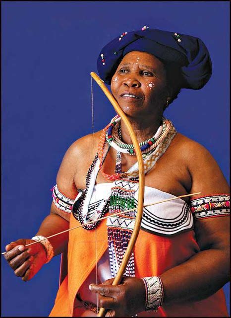 Xhosa Woman Wearing Traditional Attire With Native Wooden Violin In Her