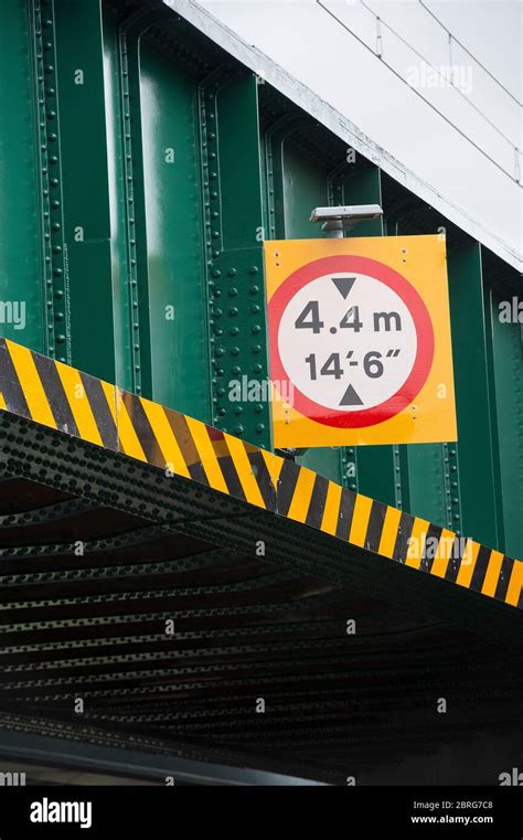 Sign Showing Height Restriction On A Railway Bridge In The Uk Stock