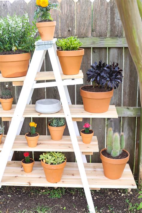 You just have to clean up, paint if you want, and then hang your ladder on the ceiling and use it to hook your sheers. DIY Tiered Plant Stand From an Old Ladder - Love & Renovations