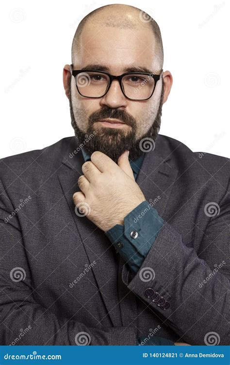 Serious Young Bald Man In Glasses With A Beard Close Up Isolated On A