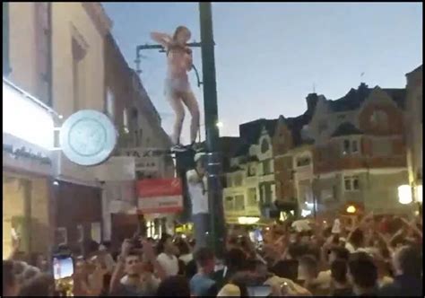 England Fan Stuns Crowds With Pole Dance Routine 15ft Up A Lamppost After World Cup Penalty