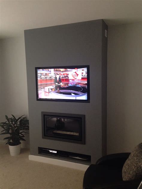 Riva Studio Balance Flue Fire With Panasonic Tv Above Living Room Tv