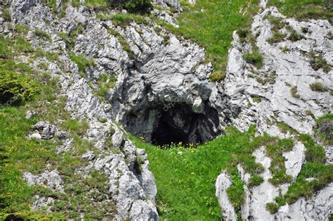 Small Cave Entrance In The Mountains Stock Photo By ©salajean 49220397