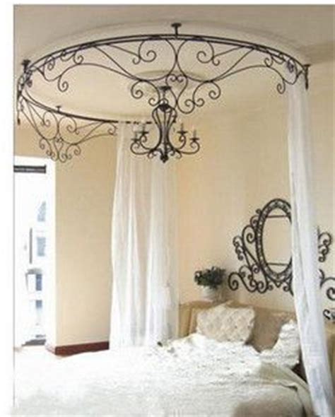 Bed is 76 wide x 84 long x 84 high. Metallic Sculpture : Wrought iron canopy and chandelier ...