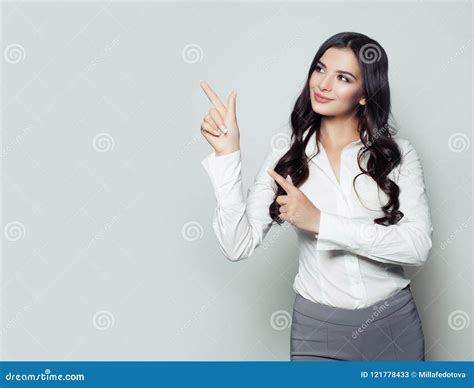 Happy Business Woman Pointing Her Finger To Empty Copy Space Stock