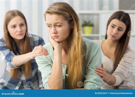 Two Friends Comforting Sorrowful Teenager Stock Image Image Of