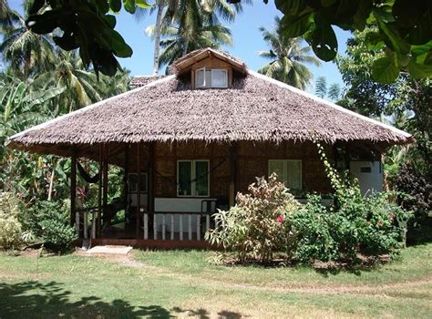 Front View Of The Newly Constructed Bahay Kubo With Garden Wooden House
