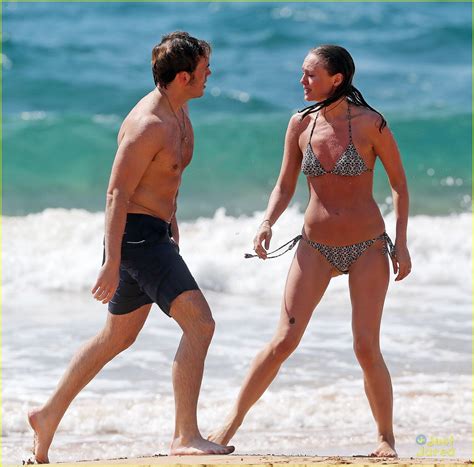 Shirtless Sam Claflin Frolics On Hawaiian Beach With Wife Laura Haddock