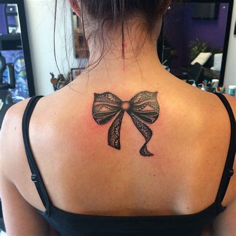 Black Lace Bow Tattoo On Girls Upper Back